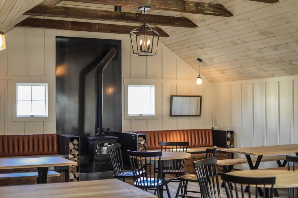 A wood stove is the centerpiece of the open upstairs. 