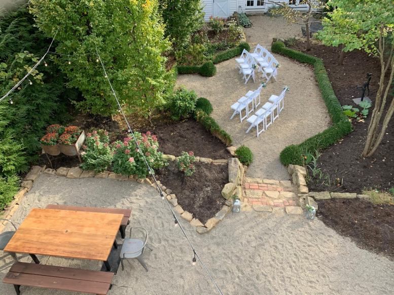 The courtyard connects the barn and the cottage.  Rent both for the perfect quaint wedding!